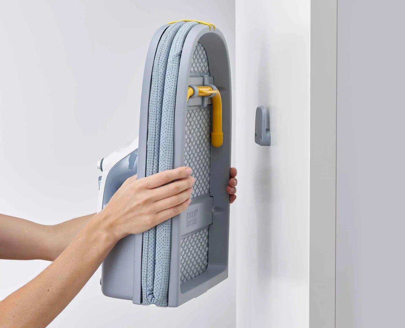 The folded board hangs on its storage hook.