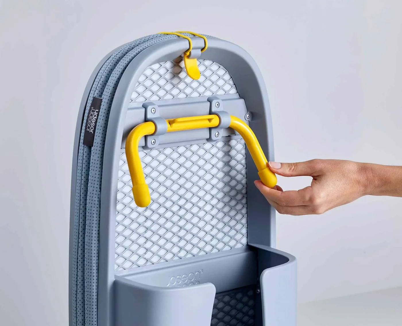 Storage compartment holding a separately supplied iron after cooling.