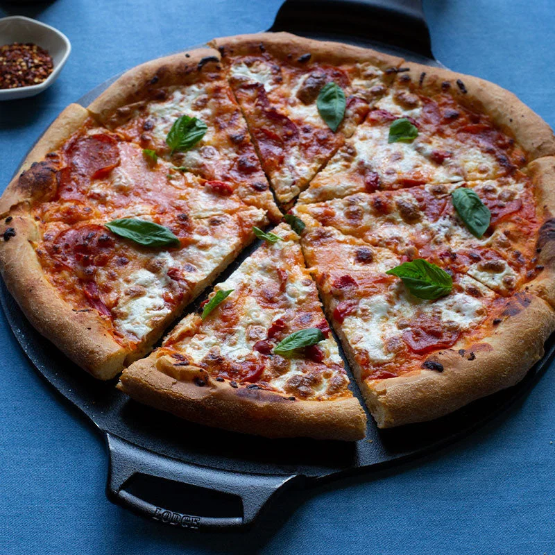 Manufacturer pizza-serving scene; crust results depend on the recipe and oven.