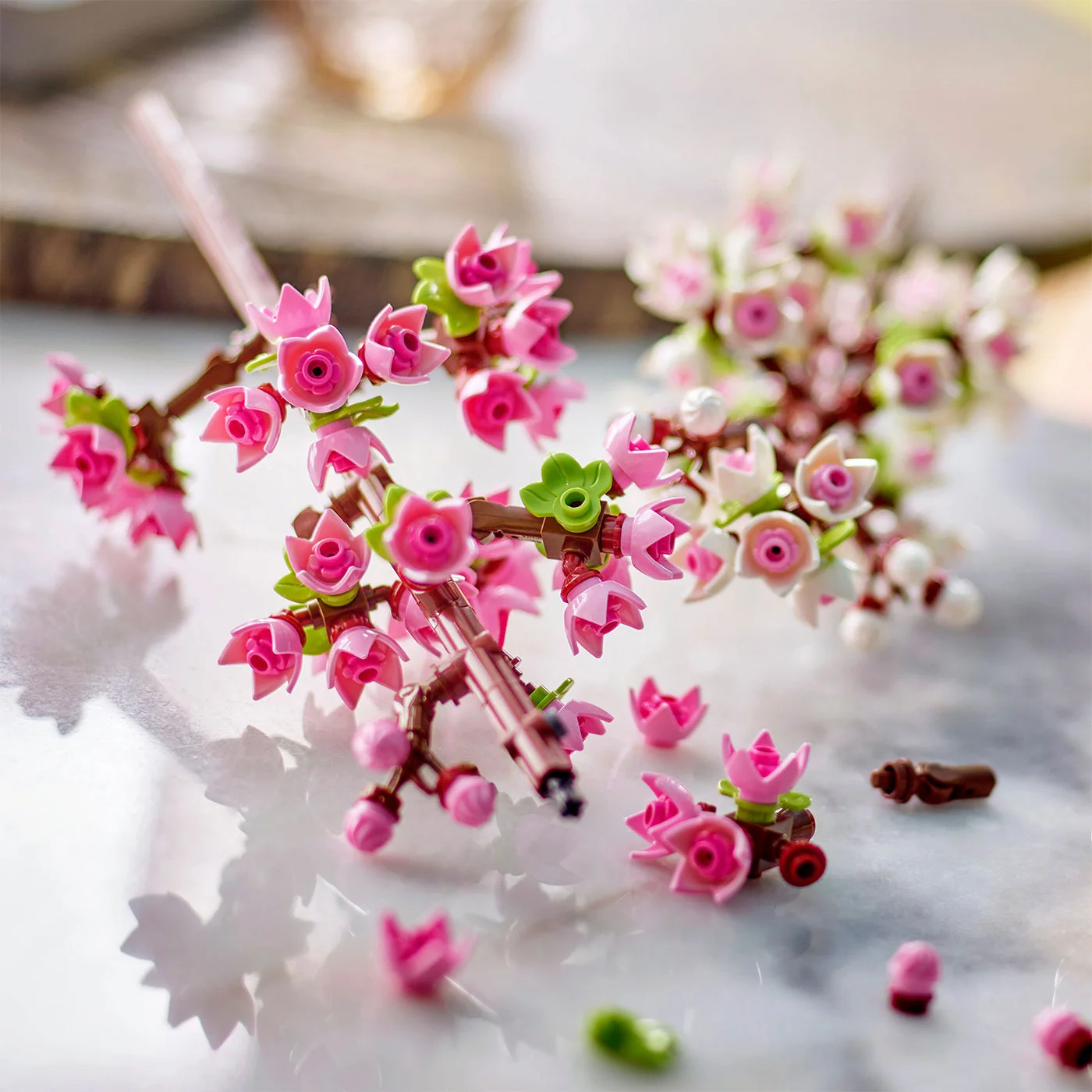 Pink and white buds shown with loose pieces during assembly.