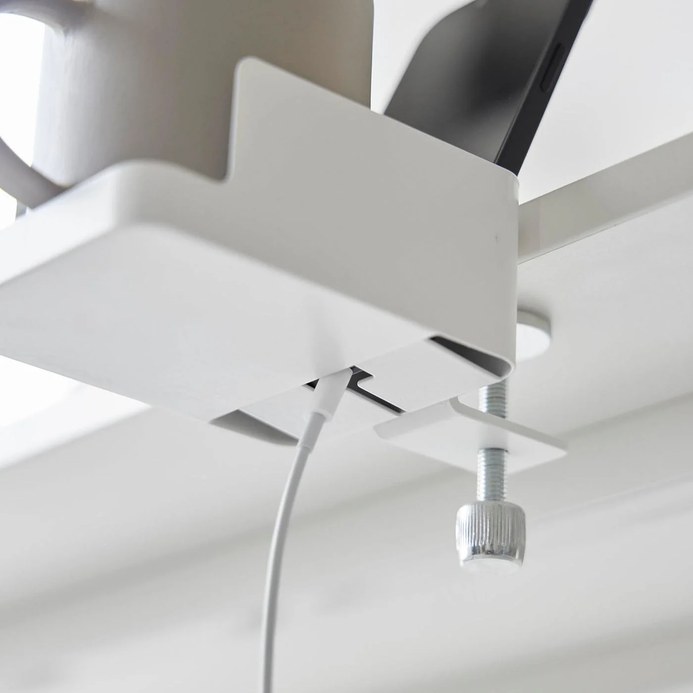White alternative showing the clamp below the tabletop; inspect your own underside and table finish before mounting.