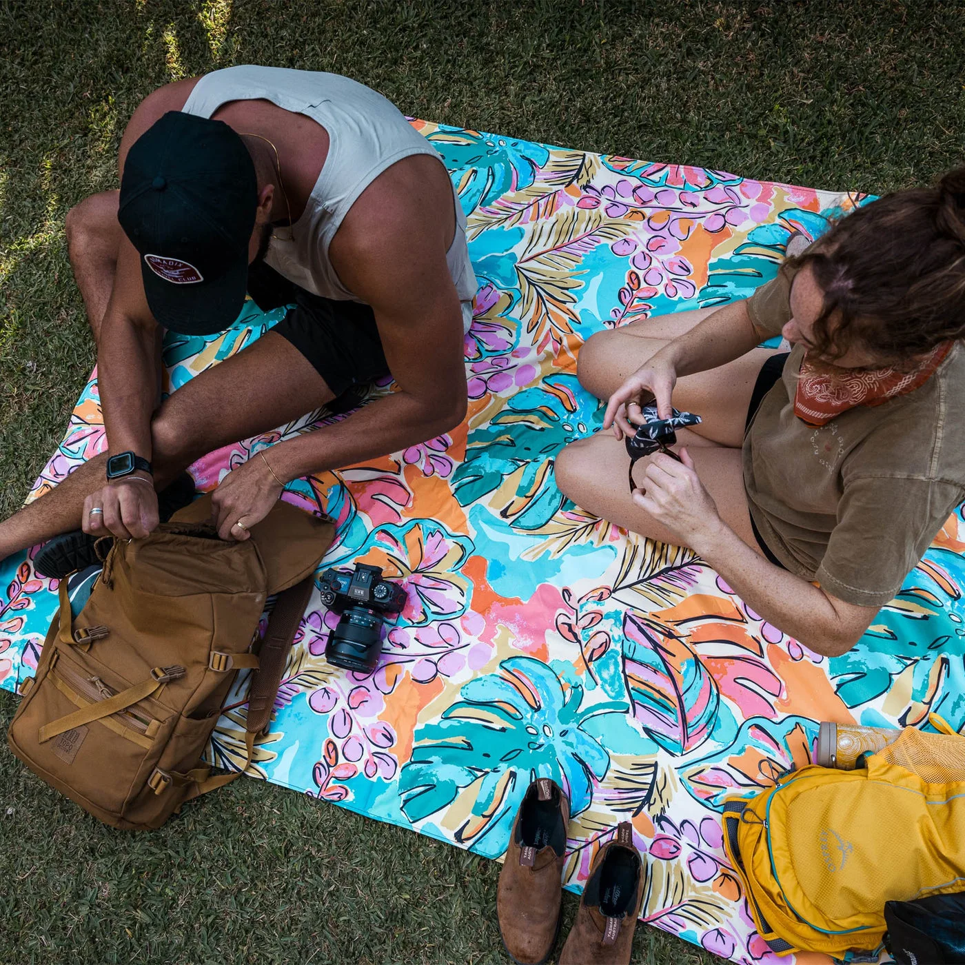 Seated picnic example with the selected Jungle print; bags and food are not included.