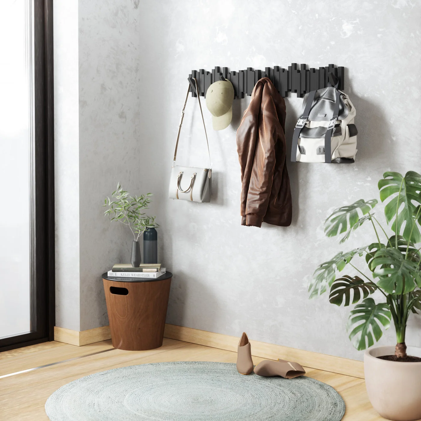 Wide entryway styling scene: the rail becomes a visible feature rather than disappearing into the wall.