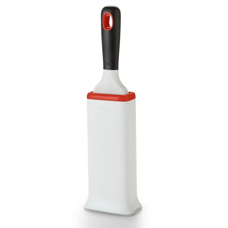 Garment FurLifter brush upright in its cleaning base.