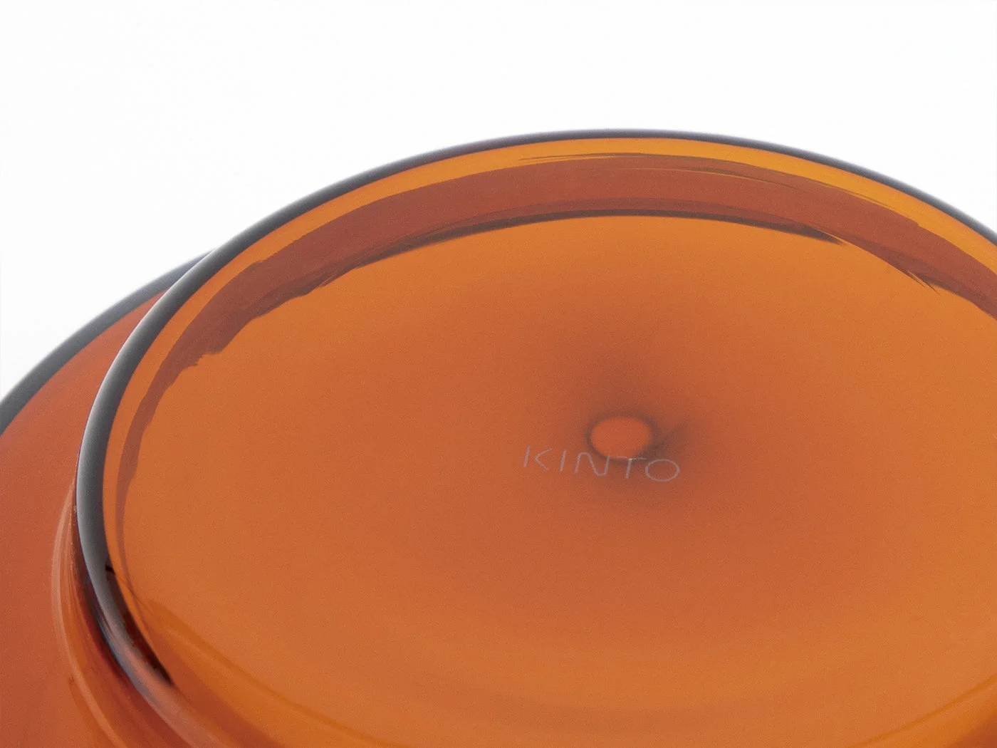 Close-up of the amber glass base and maker's mark; colour variations can arise during manufacture.