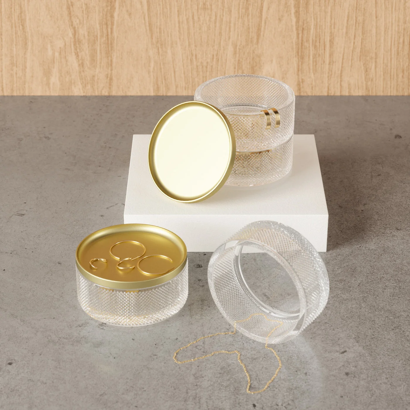 A top view of the bowls and shallow metal tray with jewelry props.