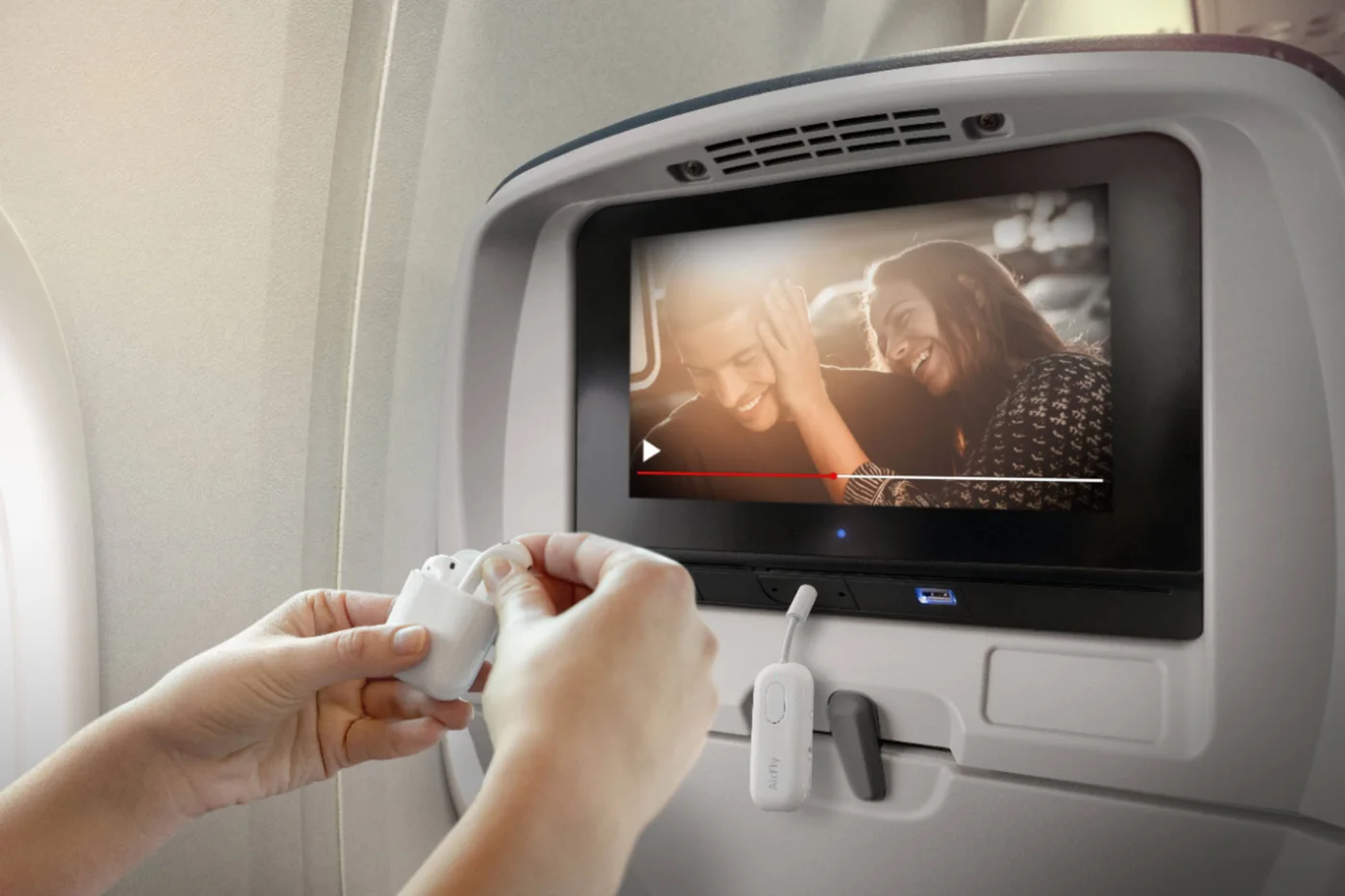 Adapter plugged into an aircraft entertainment audio output; aircraft sockets differ.
