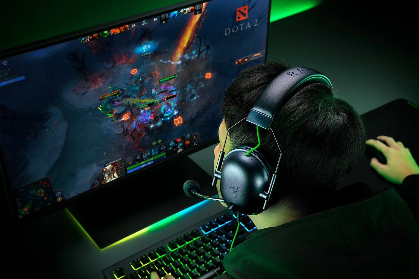 Manufacturer model wearing the black headset; this is not a FINDWEAVE hands-on test.