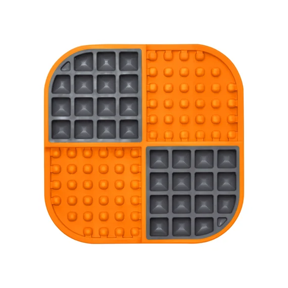 The standard orange Slomo shows alternating pockets and raised bumps across one flat feeding surface.