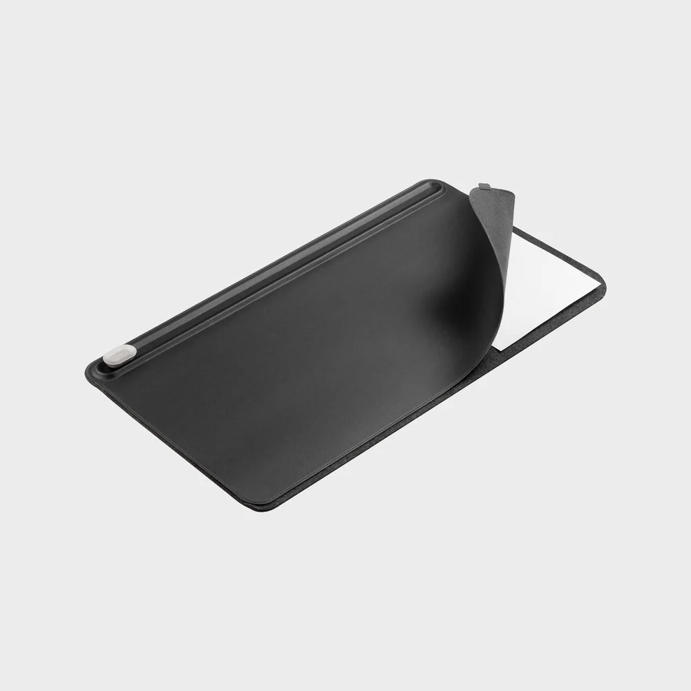 Selected Medium Black Desk Mat with the paper layer lifted.