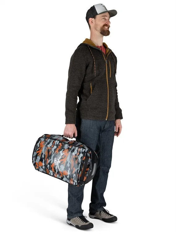 Alternate Black Orange Camo bag shown being carried in a reference scene.