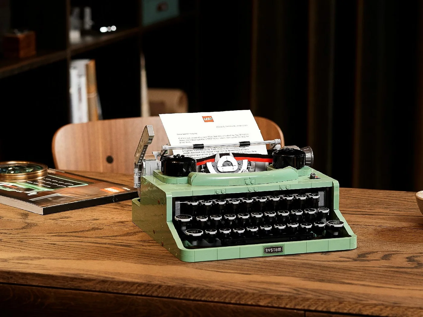 A real paper letter displayed in the roller; the model does not print text.