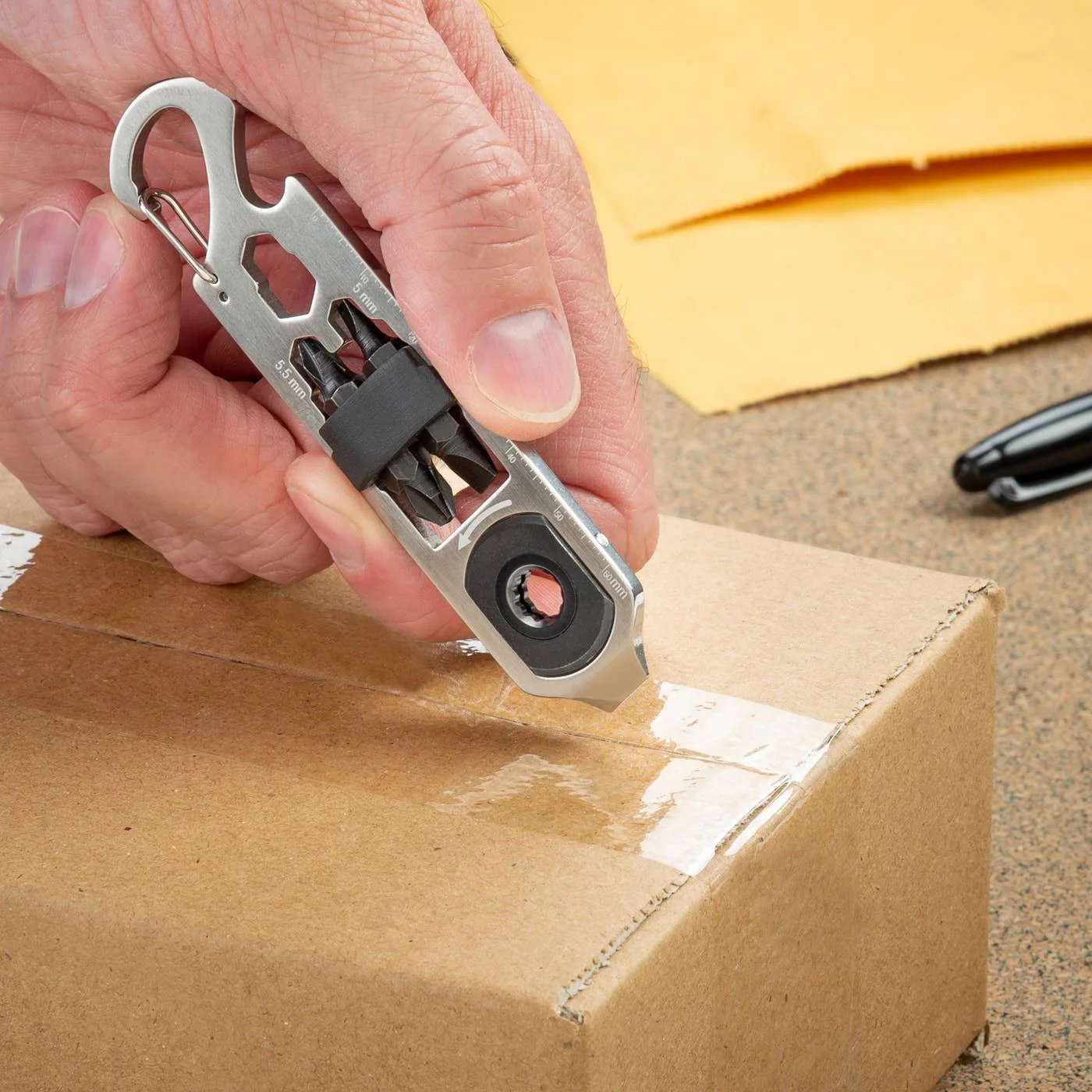 Scoring-point demonstration; control the tool carefully around packaging and contents.