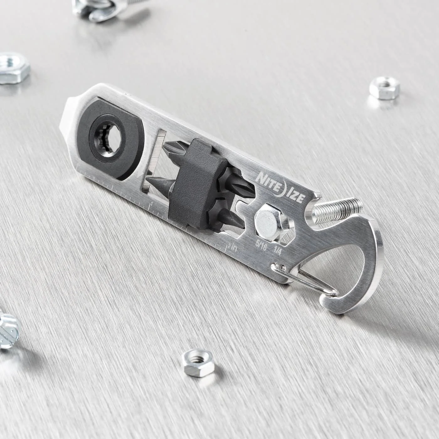 Close view of the ratchet head, clip and bit holder with demonstration screws.