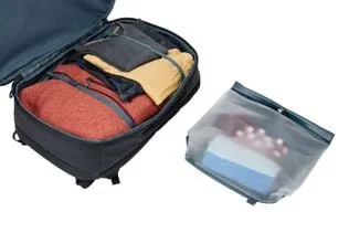Compression straps and the removable rolltop bag shown outside the packed cavity.
