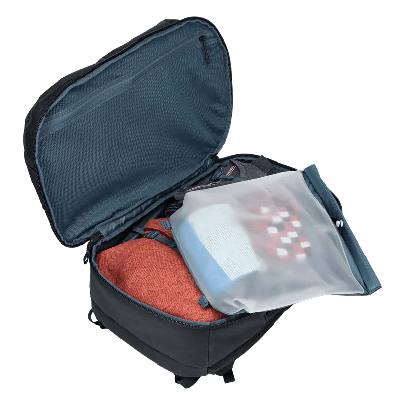 Open main compartment with the removable TPU-lined rolltop bag; clothing is illustrative.