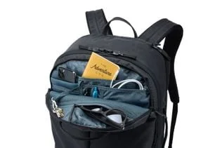 Small-access pocket with example travel items, not included accessories.