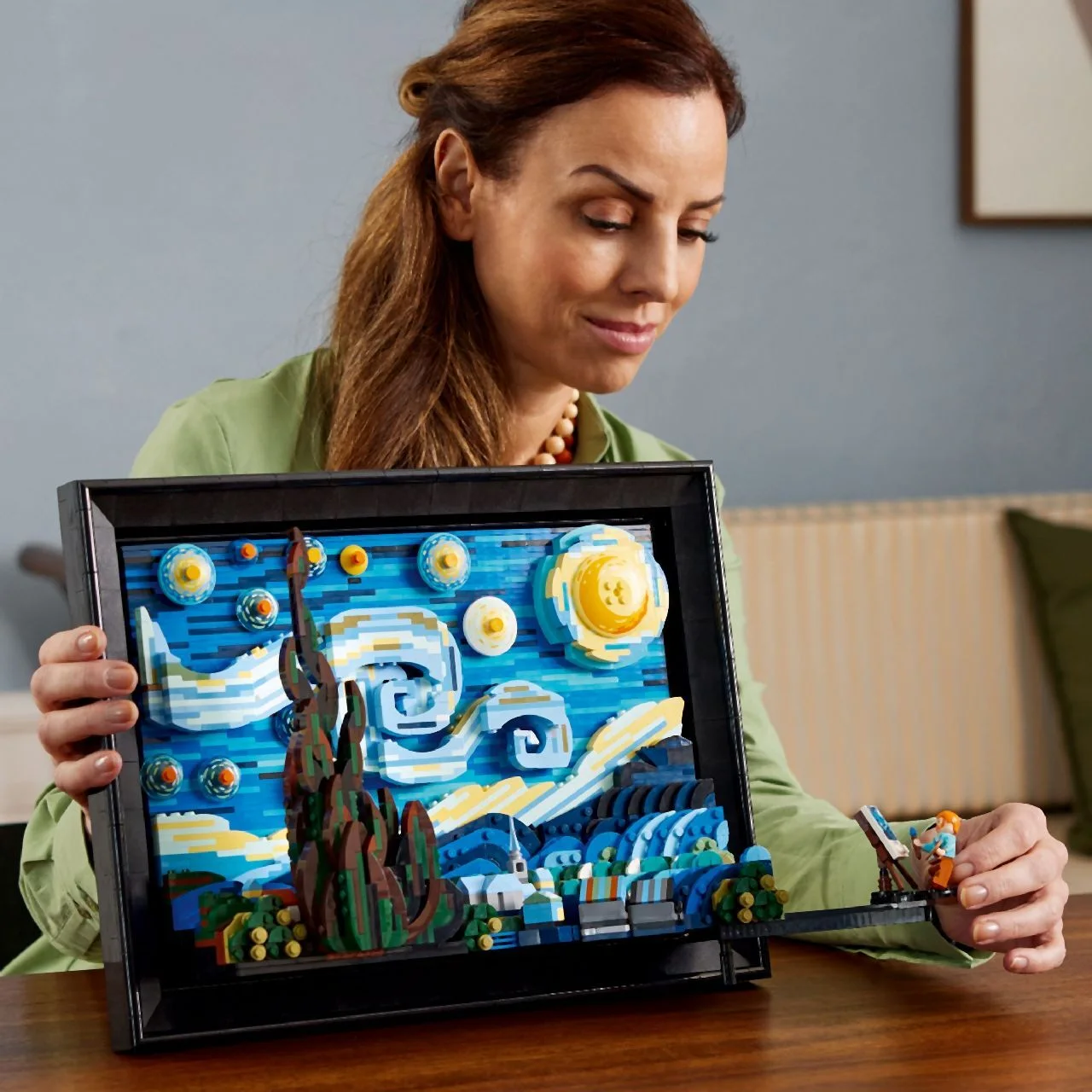 Adult handling the completed model, showing its physical scale.