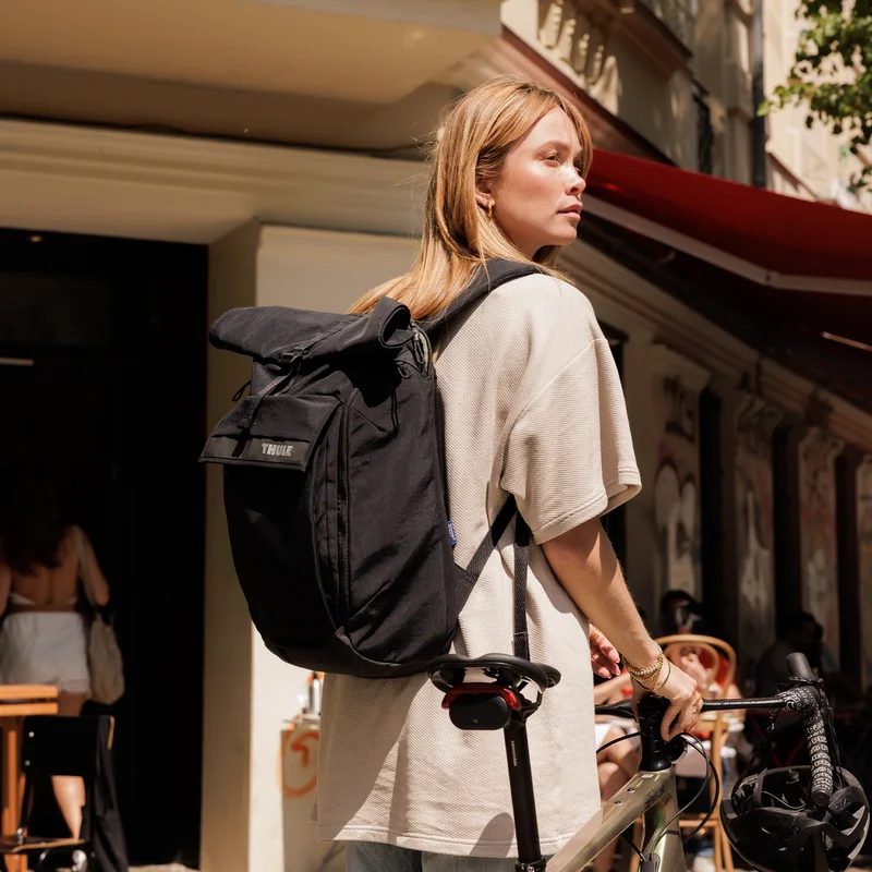Manufacturer commuting scene with the black pack; bicycle and clothing are not included.