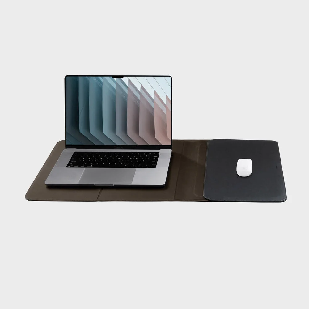 Black 16-inch Hybrid Laptop Sleeve unfolded with laptop and mouse props.