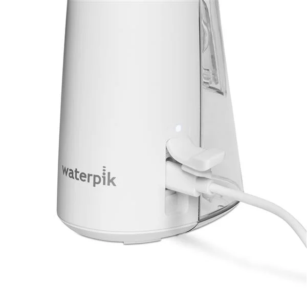 Charging-port close-up; follow the manual and keep charging separate from wet use.