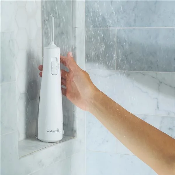 Manufacturer shower-use illustration; this does not permit wet charging.