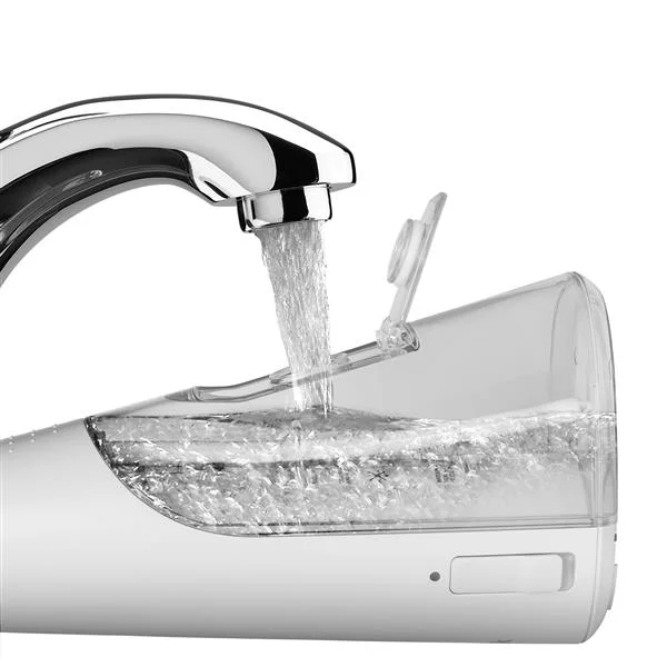 Refilling the small reservoir at a tap.