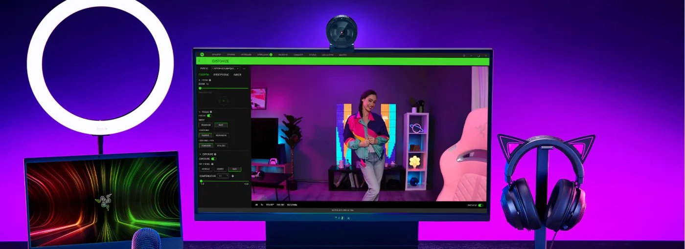 Razer configuration-screen example with the webcam above the monitor; other desk accessories are illustrative.