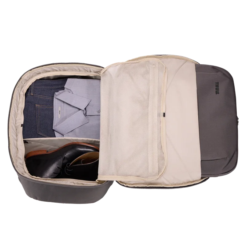 Open travel compartment and fold-flat internal divider; example contents are not included.