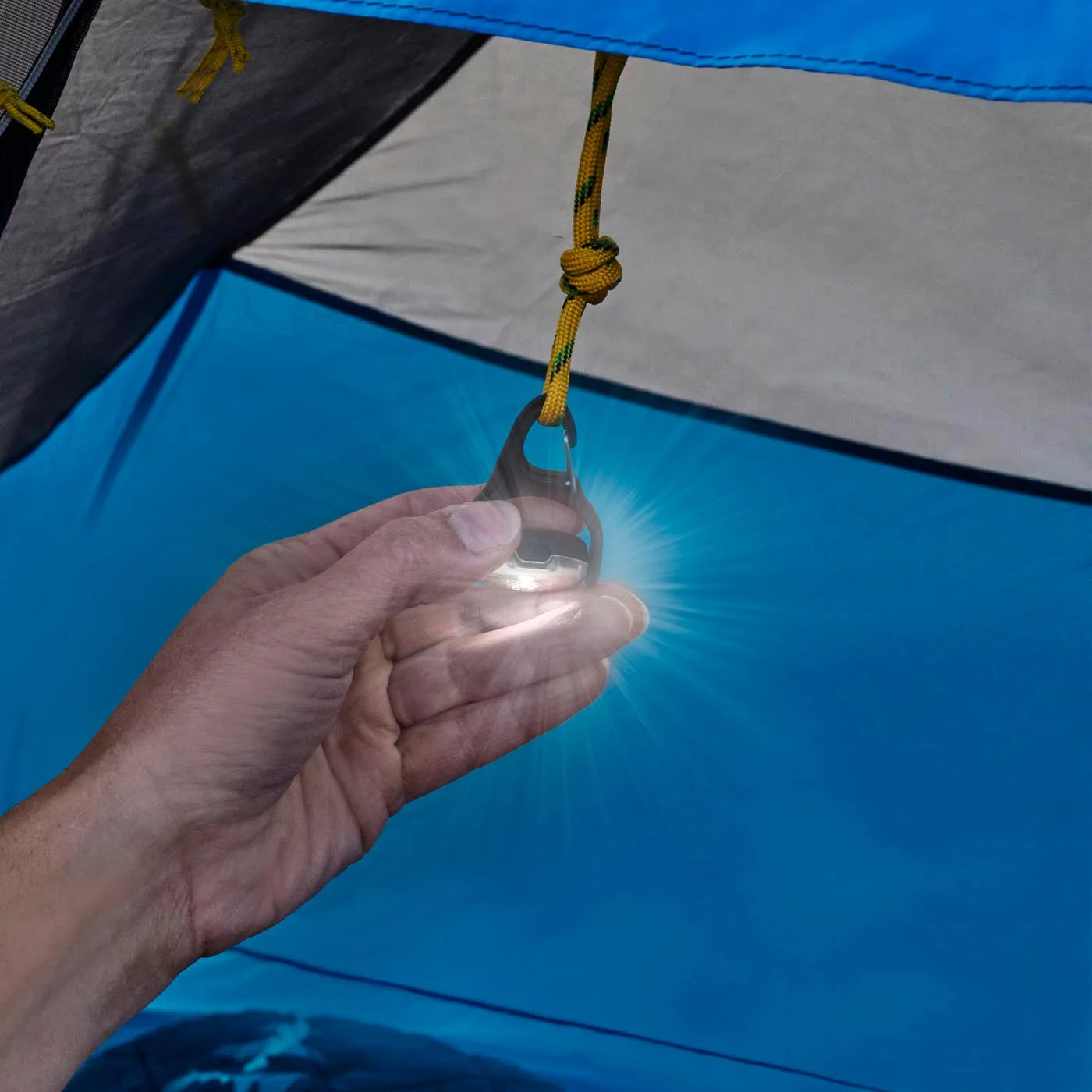 Maker demonstrates repositioning the swivel body while it remains clipped to a tent loop.