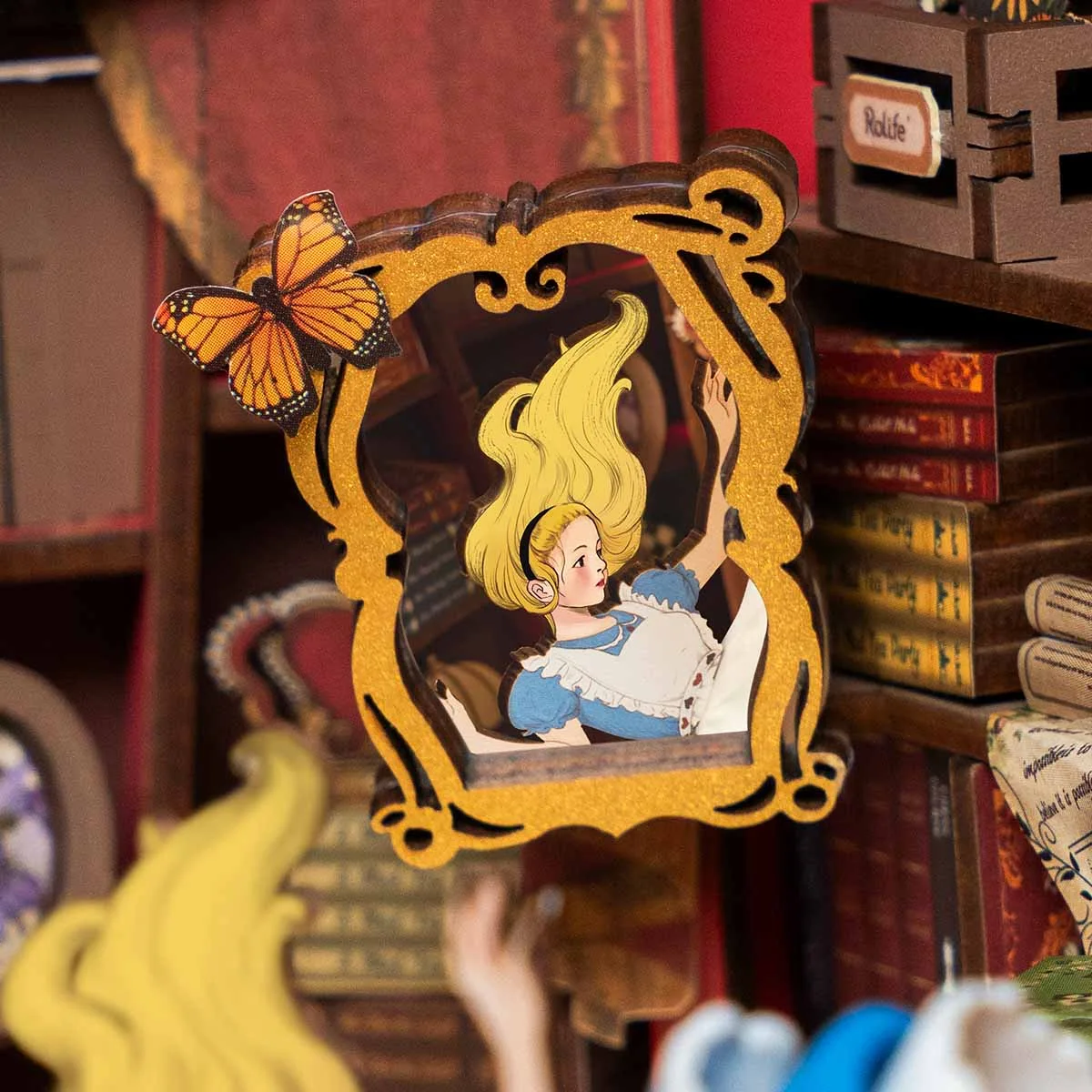 Alice figure and layered paper detail