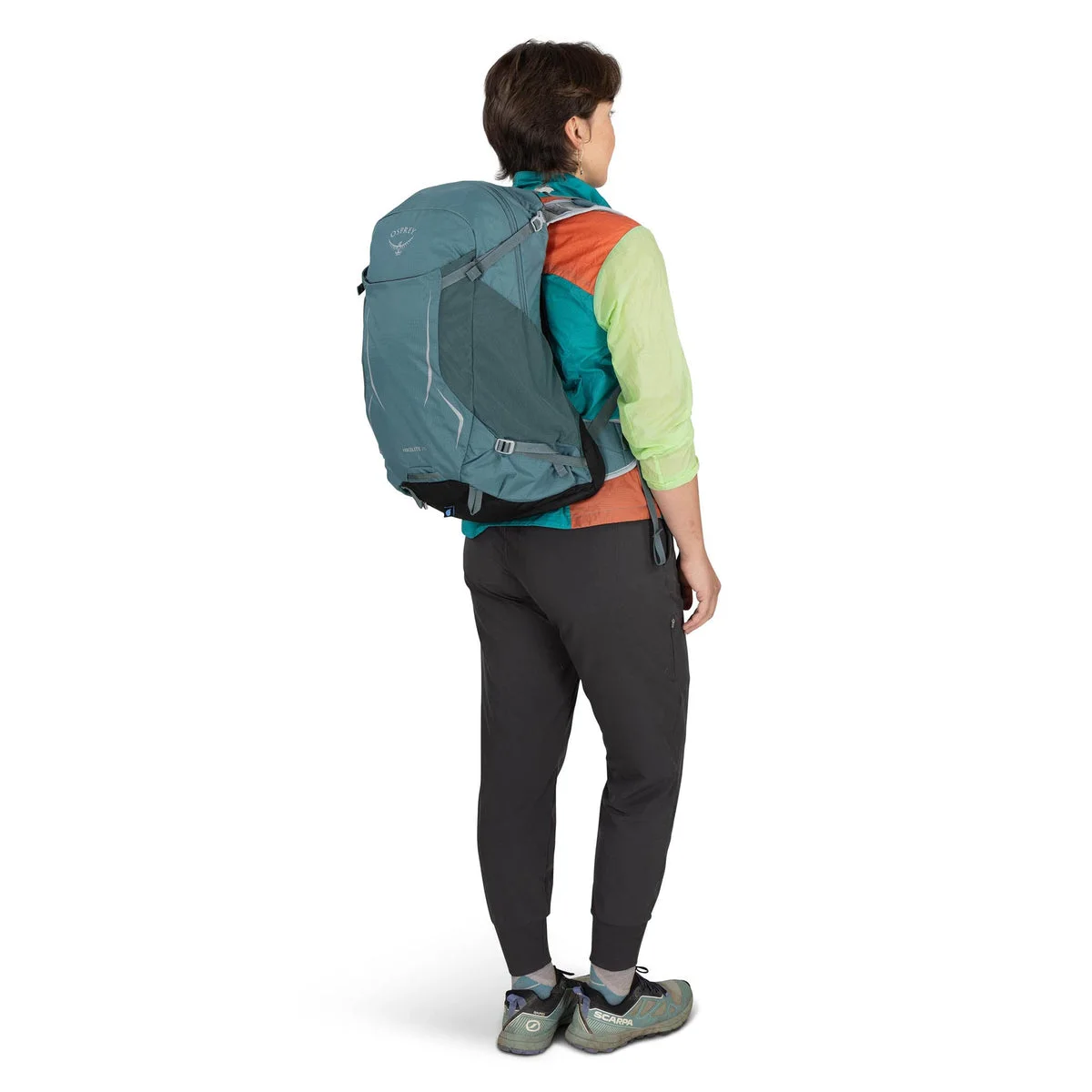 Blue same-model second-model rear three-quarter carry view.