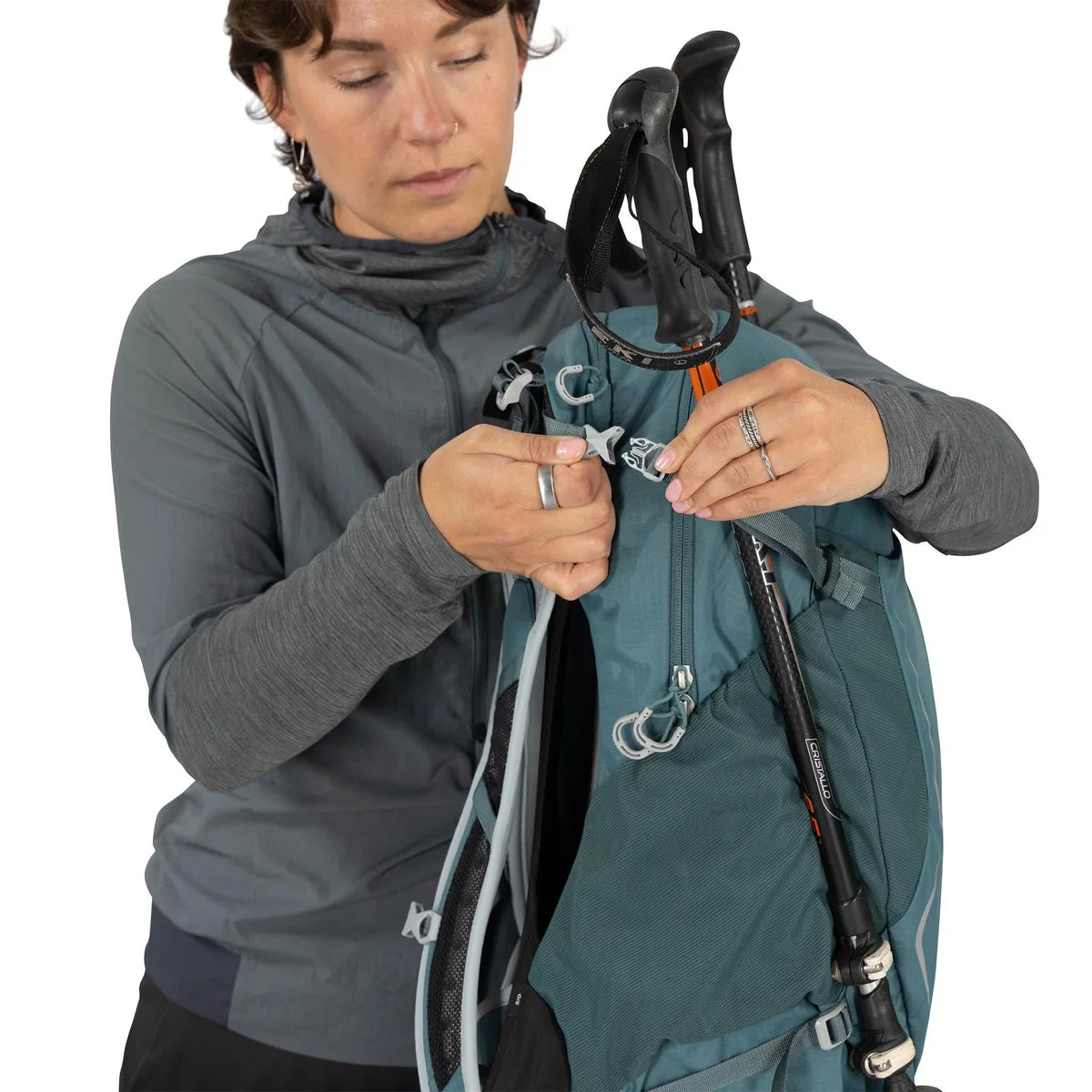 Blue same-model trekking-pole attachment demonstration; poles not included.