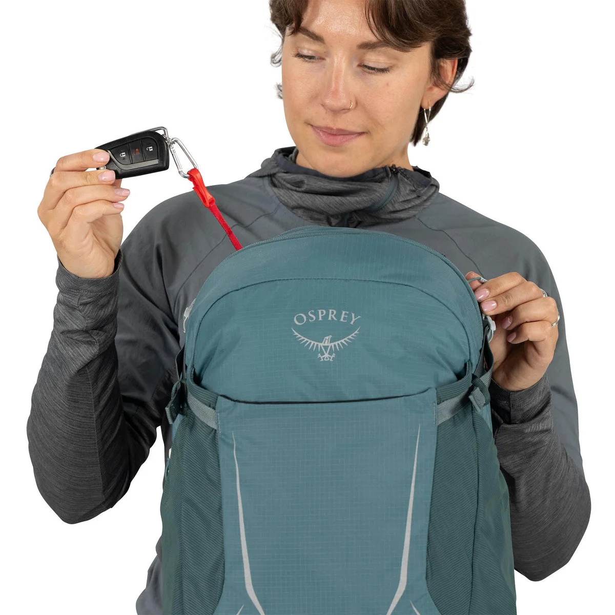 Blue same-model demonstration of the small-item pocket; not selected color.
