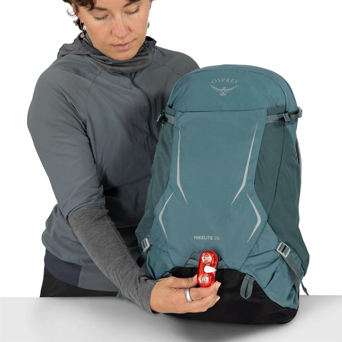 Blue same-model demonstration of the lower raincover compartment.