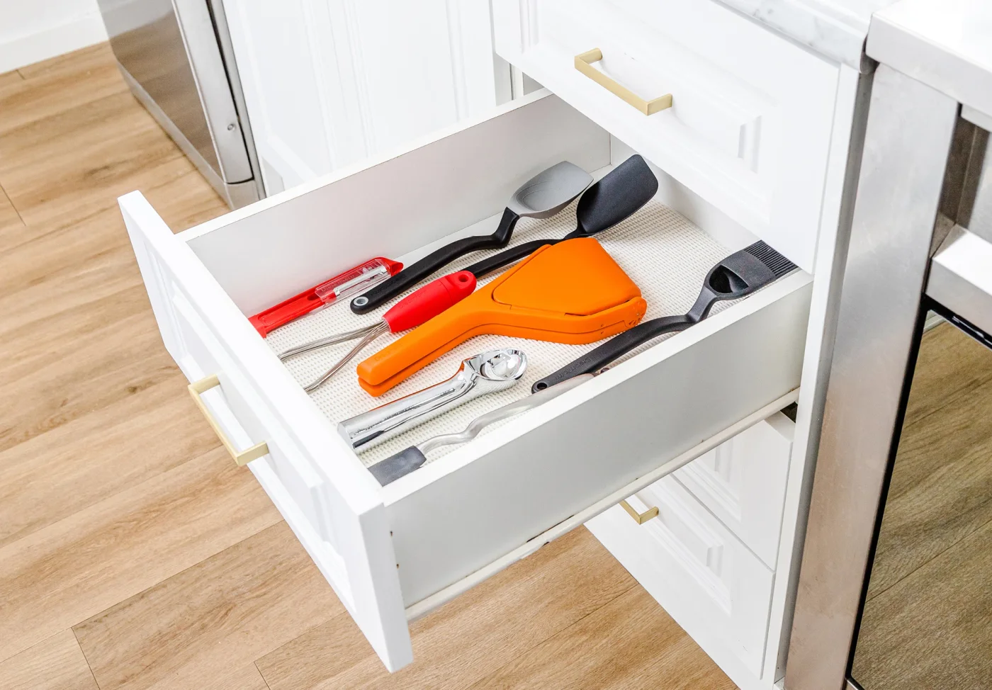Maker drawer scene shows the orange model folded flat; yellow has the same folding principle but a different size.