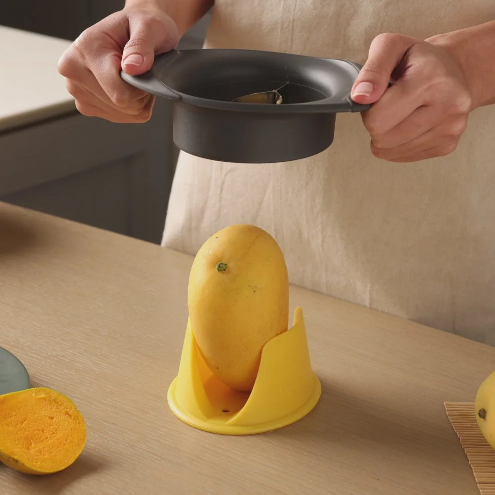 Cutter supported over the fruit in a maker preparation demonstration.