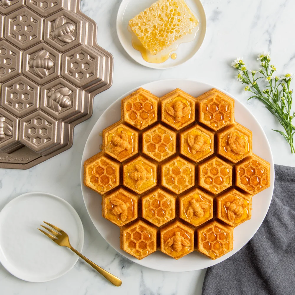 Honey drizzle over the patterned cake; presentation reference, not our baking test.