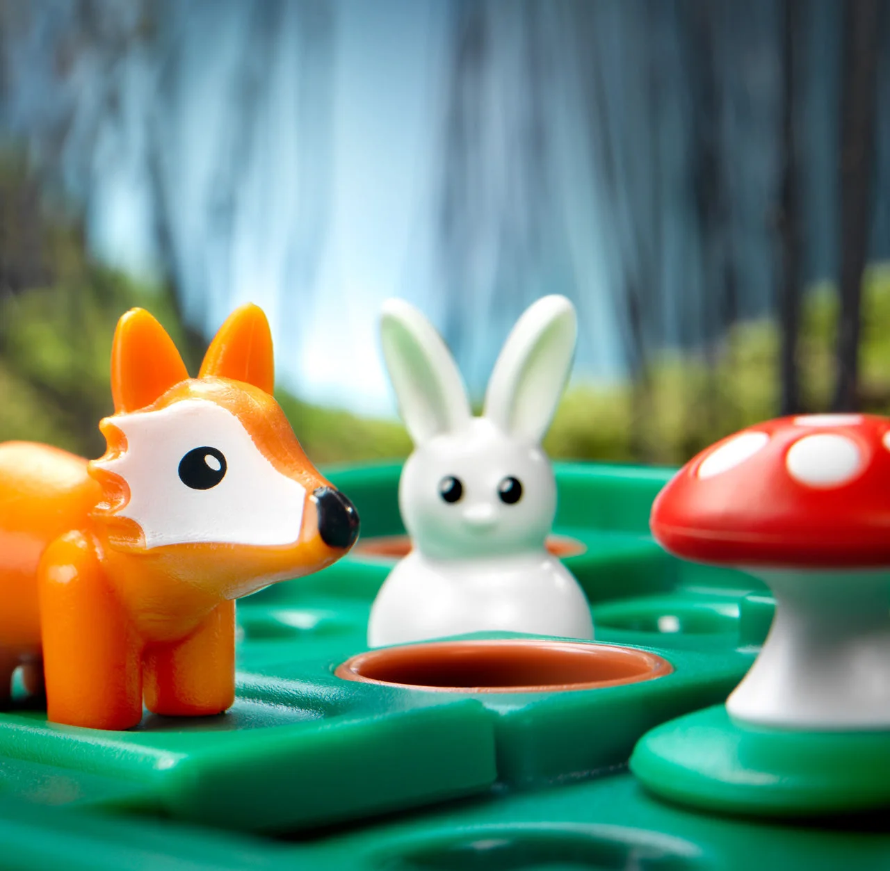 Close-up of rabbit, fox and mushroom figures in a maker scene.