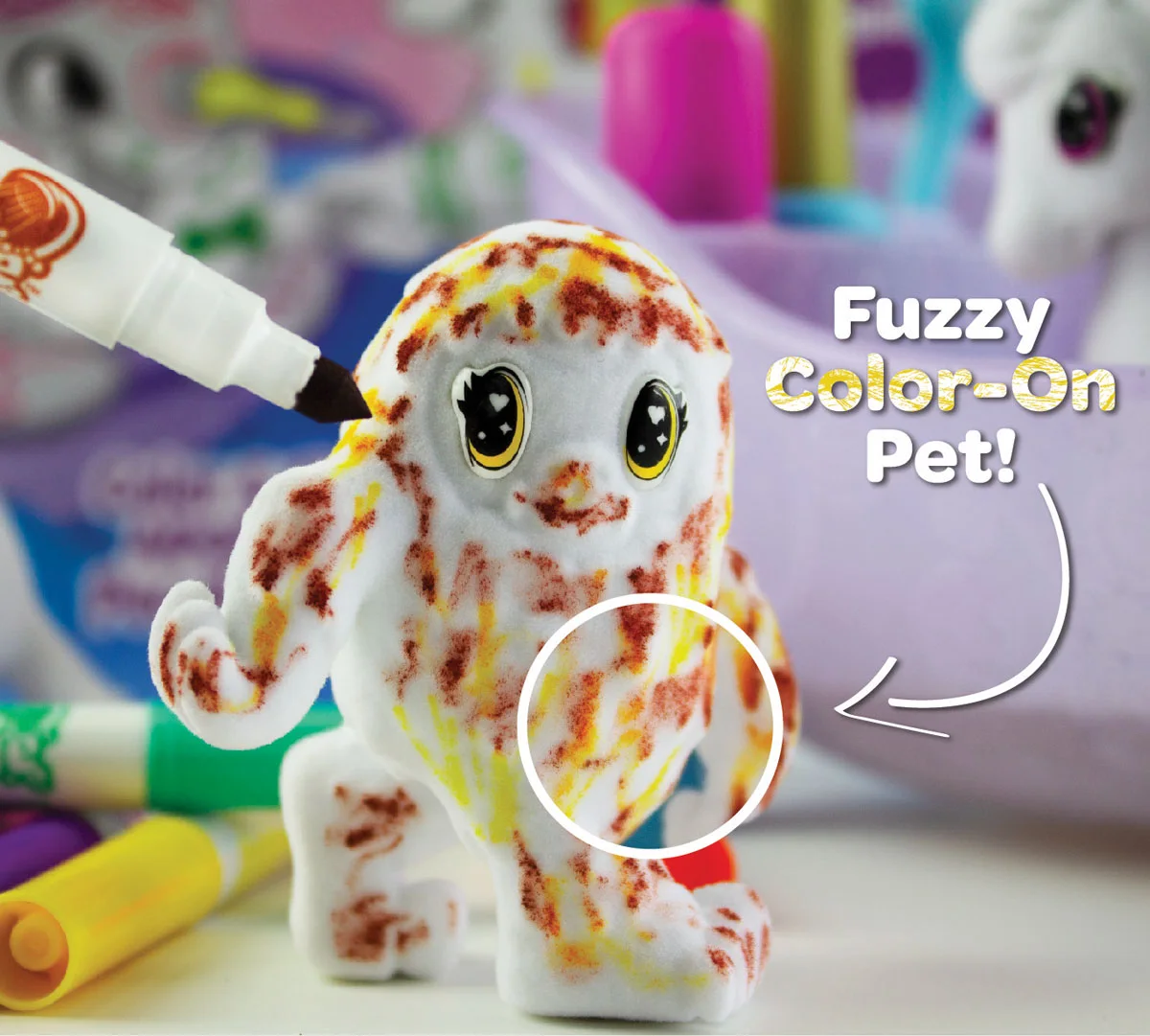 Close view of a coloured fuzzy yeti figure from the manufacturer.