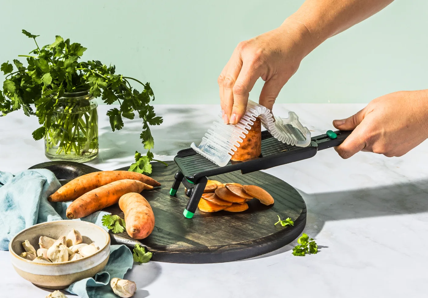 Guard held over a vegetable during a maker cutting demonstration.