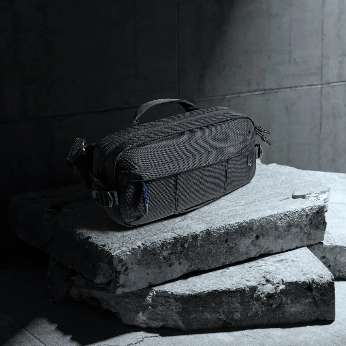 Black sling exterior in a staged manufacturer scene.