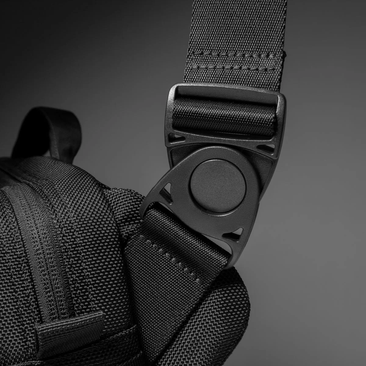 Detachable buckle detail on the selected black sling.