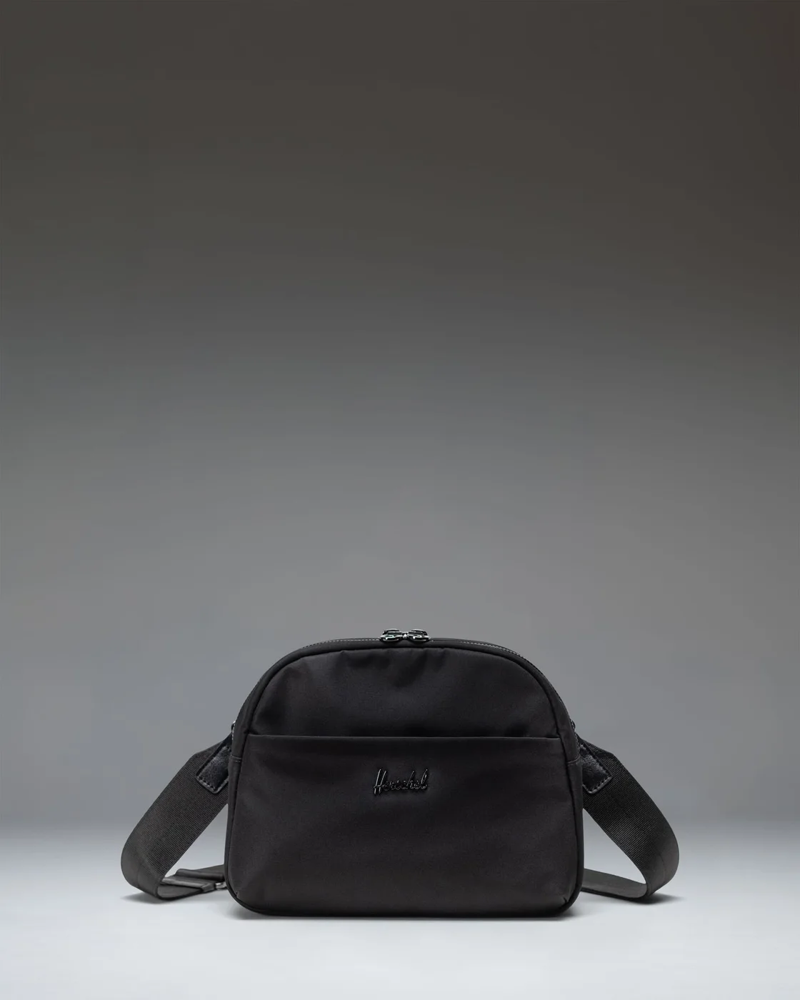 Thalia Black2L front view with zip pocket and restrained logo.