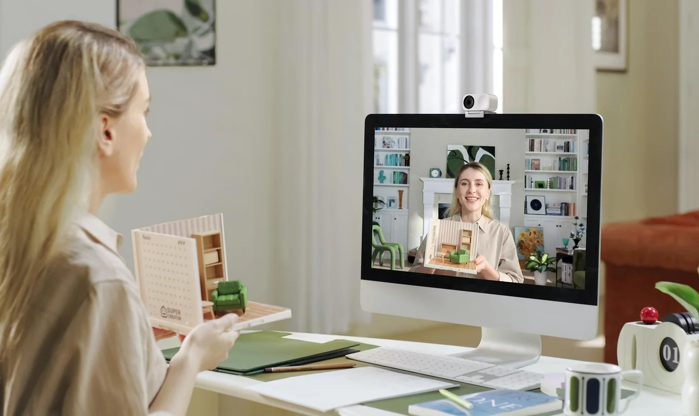 Manufacturer desktop call scene with Link 2 positioned above a monitor.