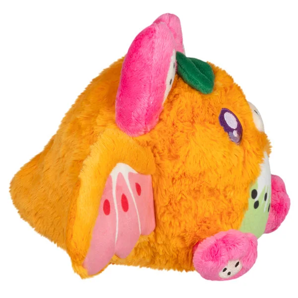 Side view of the fruit-themed body and curved nose.