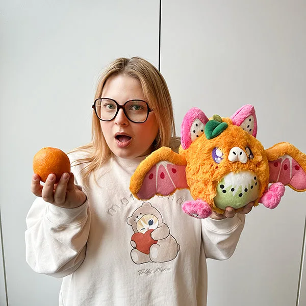 Brand-gallery scene with a person and fruit; a visual reference, not our review.