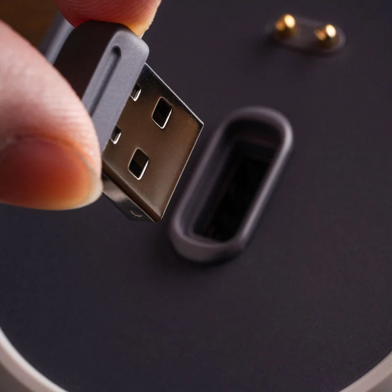 Manufacturer handling photograph shows the wireless adapter being accessed at the dock.