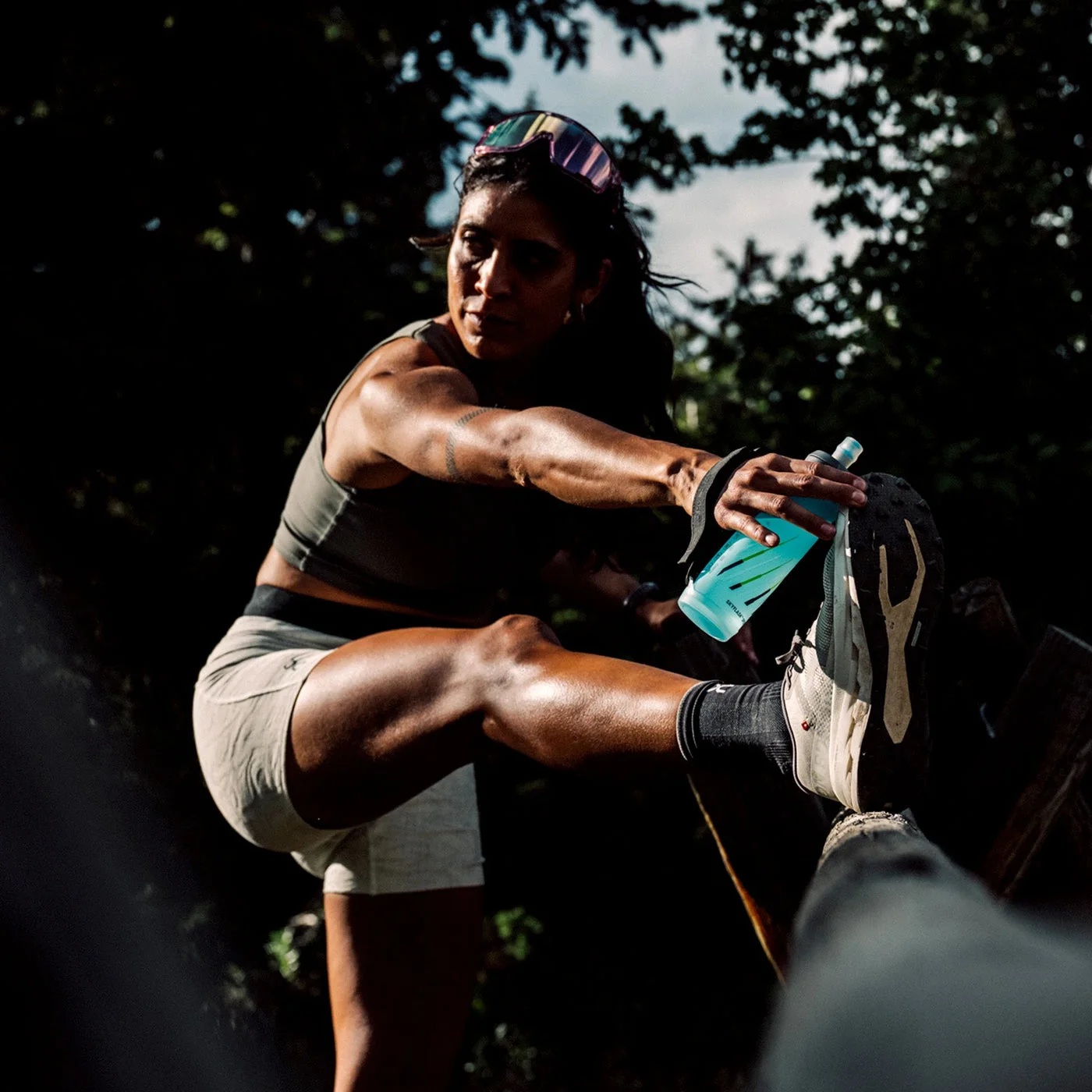 Handheld carry arrangement in a manufacturer lifestyle photograph.