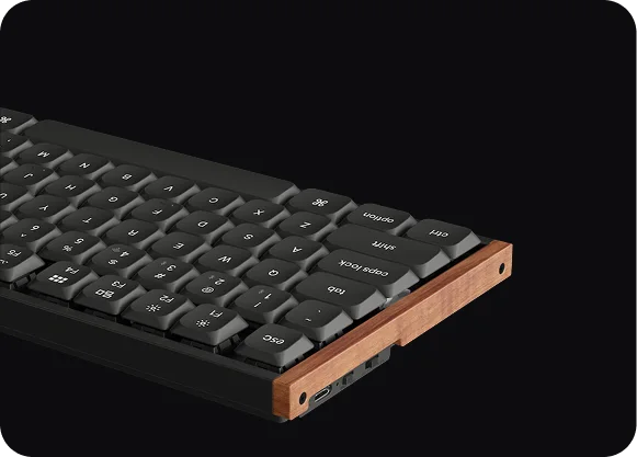 Low-profile keys, knob and wood side detail.